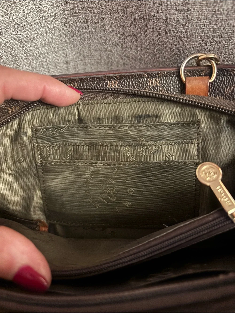 Rioni Dark Brown Monogram wristlet Bag